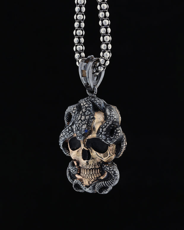 Skull and snake figure necklace